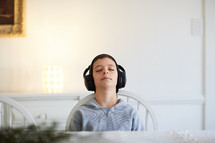 boy listening to headphones
