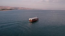 Drone footage of a tourist boat in the Sea of Galilee in Israel,