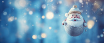 Christmas background with colorful Santa Claus bauble, bell and glitter light bokeh.