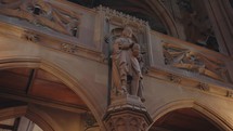 The Gothic-themed statues of notable figures inside the John Rylands Research Institute and Library in Manchester, UK.