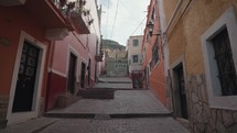 Walking on Small Narrow Street Alley with Colorful Buildings Guanajuato, Mexico
