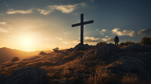 A man standing by a cross thinking at sunrise. 