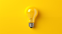 Yellow light bulb on yellow background. Idea concept. 