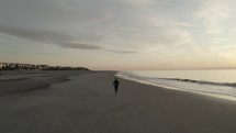 man running on a beach 