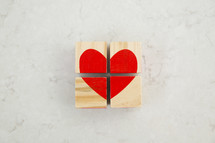 red heart painted on wood blocks 