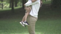 Portrait of Mother and Child Love Hug Bond at The Park - in Slow Motion
