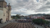 Crowd During Day of The Dead Dia de Los Muertos Festival in front of Templo de Santo Domingo de Guzman Church and Convent Oaxaca, Mexico