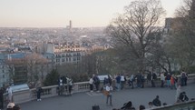 Paris, France - March 21, 2024: Tourists enjoys the view of Paris from atop Montmartre