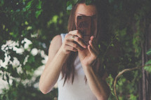 a woman with a cellphone taking a picture 