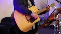 playing a guitar during a worship service 