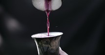 Wine pouring into a wine goblet