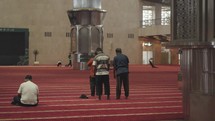 Indonesian Muslim People Salah Salat Praying in Istiqlal Mosque Jakarta, Indonesia