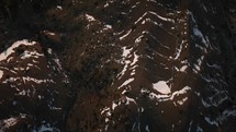 Top down drone view of snowy mountains in Albania during sunset