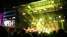 musicians on stage and stage lights at a concert 