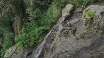 Bathing Soaking in Natural Forest Rock Pool Jacuzzi at Gembleng Waterfall Karangasem Bali Indonesia in Slow Motion