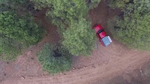 Downward aerial view of a campsite in the woods