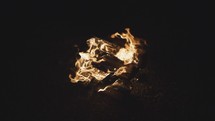 flames from a campfire at night 