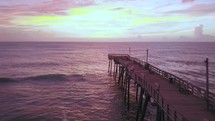 aerial view over a pier at sunset 