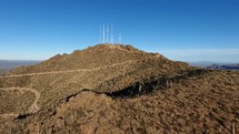 Aerial of radio broadcast towers on a mountain top