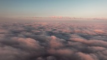 Scenic view above the clouds during sunrise