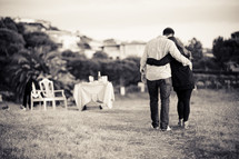 man and woman embracing - walking outdoors - dinner