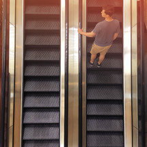 a man on an escalator 