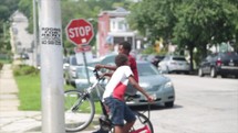 child riding a bike on a neighborhood street 