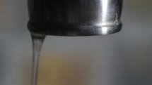 Close up of water dripping from a faucet