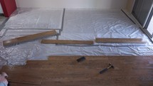 Timelapse of a man installing a laminate floor on a home construction project