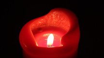 red candle with melting wax 
