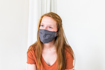 teen girl in a face mask 