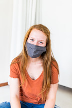 teen girl in a face mask 