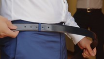 Man is wearing a belt 
