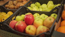 Fresh apples on display in market.