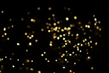 Bokeh from golden Christmas lights in the background. Perfect for your advent designs.
