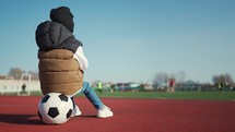 Little boy dreams of becoming a famous footballer. Training. Health. Happy childhood.
