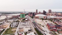 A complete aerial landscape view of downtown Saint Louis, Missouri city on a clear sky day with bridges and skyscrapers.