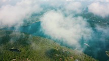 aerial view in the clouds over a bay 