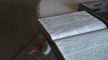open Bible on a coffee table 