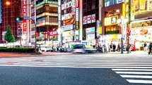 TOKYO - OCT 1st, 2022: People crossing an intersection in Kabukicho entertainment district in Shinjuku, Tokyo
