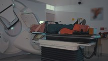 Patient Getting Radiation Therapy Treatment in a hospital oncology center