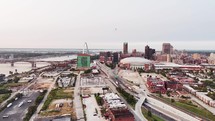 A complete aerial landscape view of downtown Saint Louis, Missouri city on a clear sky day with bridges and skyscrapers.