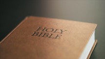 Various close up shot of Bible on table - Handheld shot