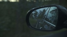 view from a rearview mirror while driving 