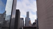 Drone video flying past downtown buildings with the Pennzoil Place and Gulf Building in the background in Houston, Texas.