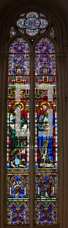 Saints on stained glass windows colorful church Montpellier