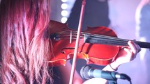 woman playing a violin 
