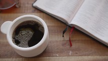 coffee and an opened Bible