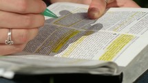a woman underlining and highlighting scripture 