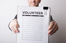 A man signing up to be a volunteer